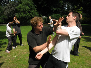 Students practising a double palm shocking technique Students practising a double palm shocking technique